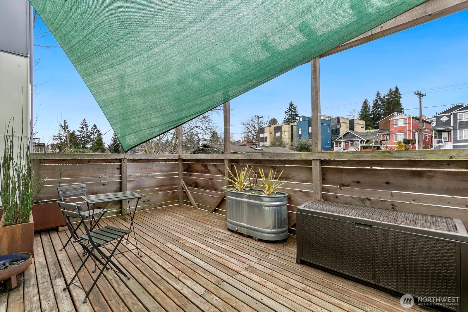 3527 South Oregon Street Seattle, WA 98118 - Photo 21 of 24 a view of a balcony with chairs and wooden floor