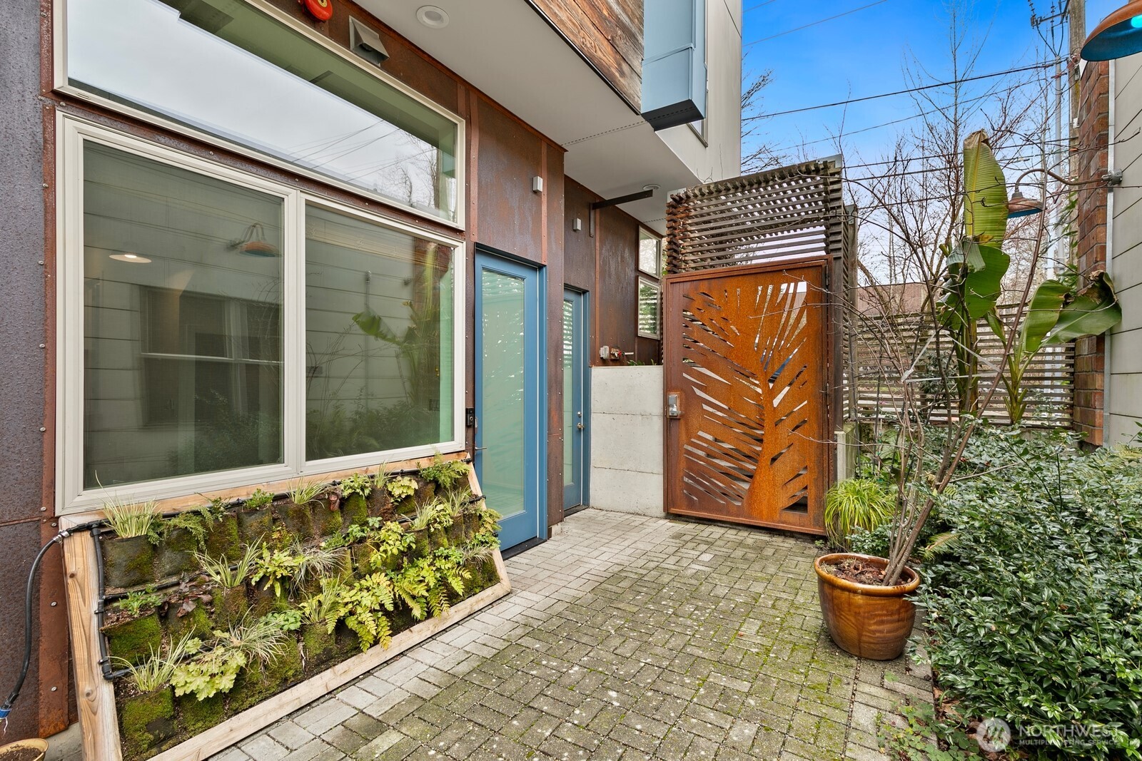 3527 South Oregon Street Seattle, WA 98118 - Photo 23 of 24 a view of a back yard with a wooden fence