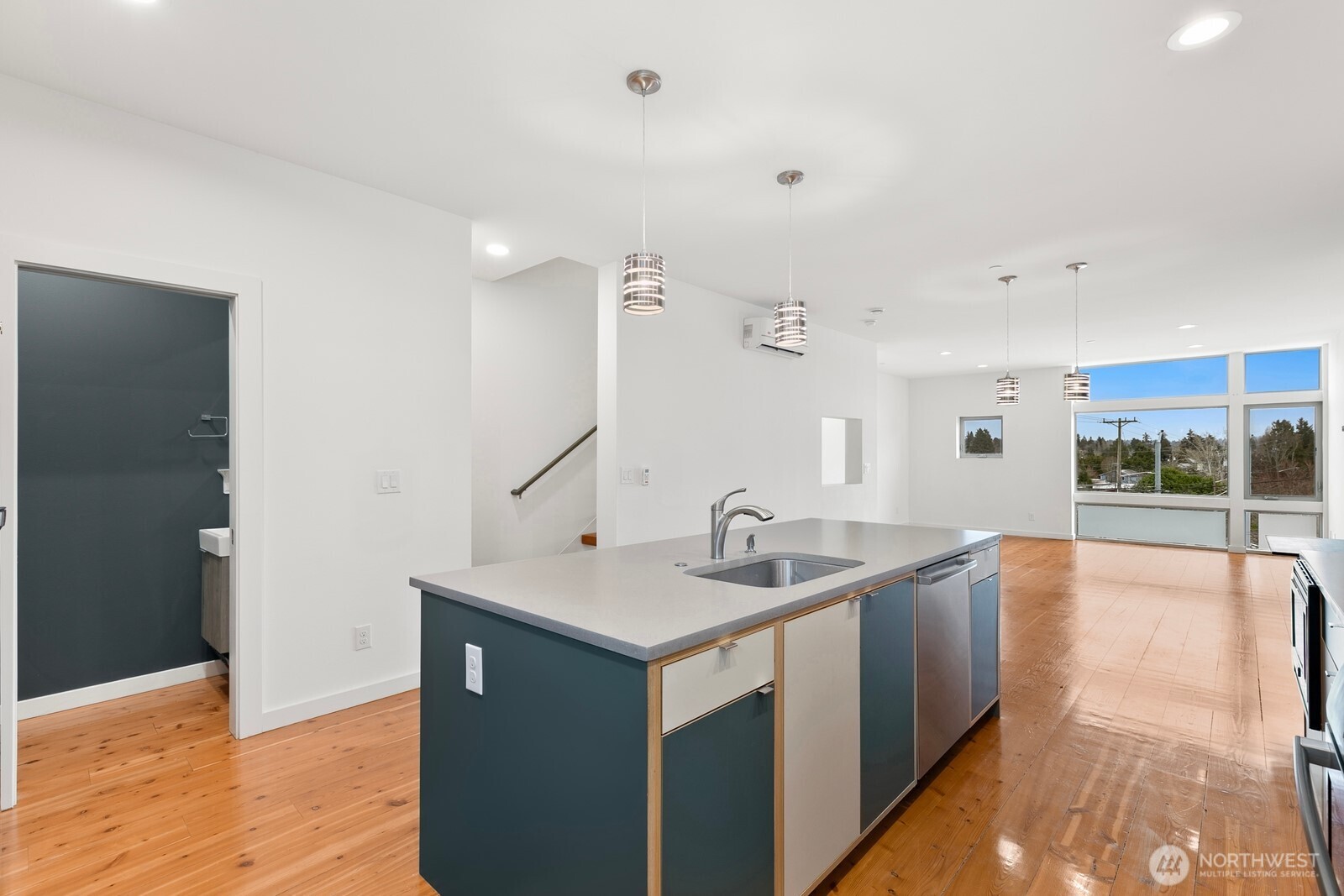 3527 South Oregon Street Seattle, WA 98118 - Photo 5 of 24 a kitchen with a sink and wooden floor