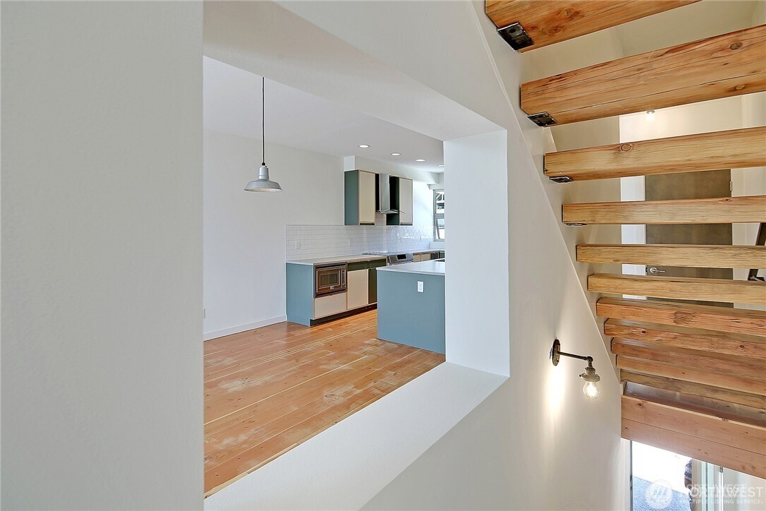 3527 South Oregon Street Seattle, WA 98118 - Photo 7 of 24 a view of kitchen and wooden floor