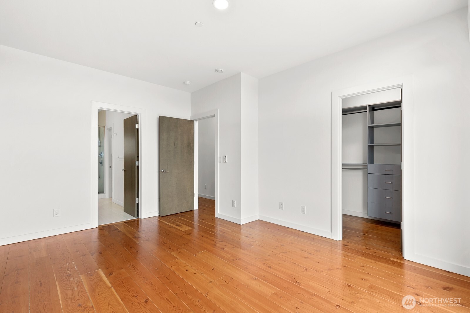 3527 South Oregon Street Seattle, WA 98118 - Photo 9 of 24 a view of empty room with wooden floor