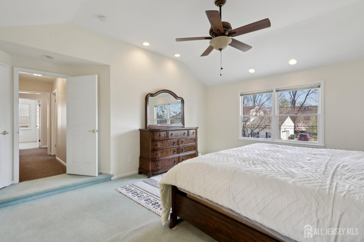 53 Salem Street Edison, NJ 08820 - Photo 19 of 39 a bedroom with a bed and a chandelier