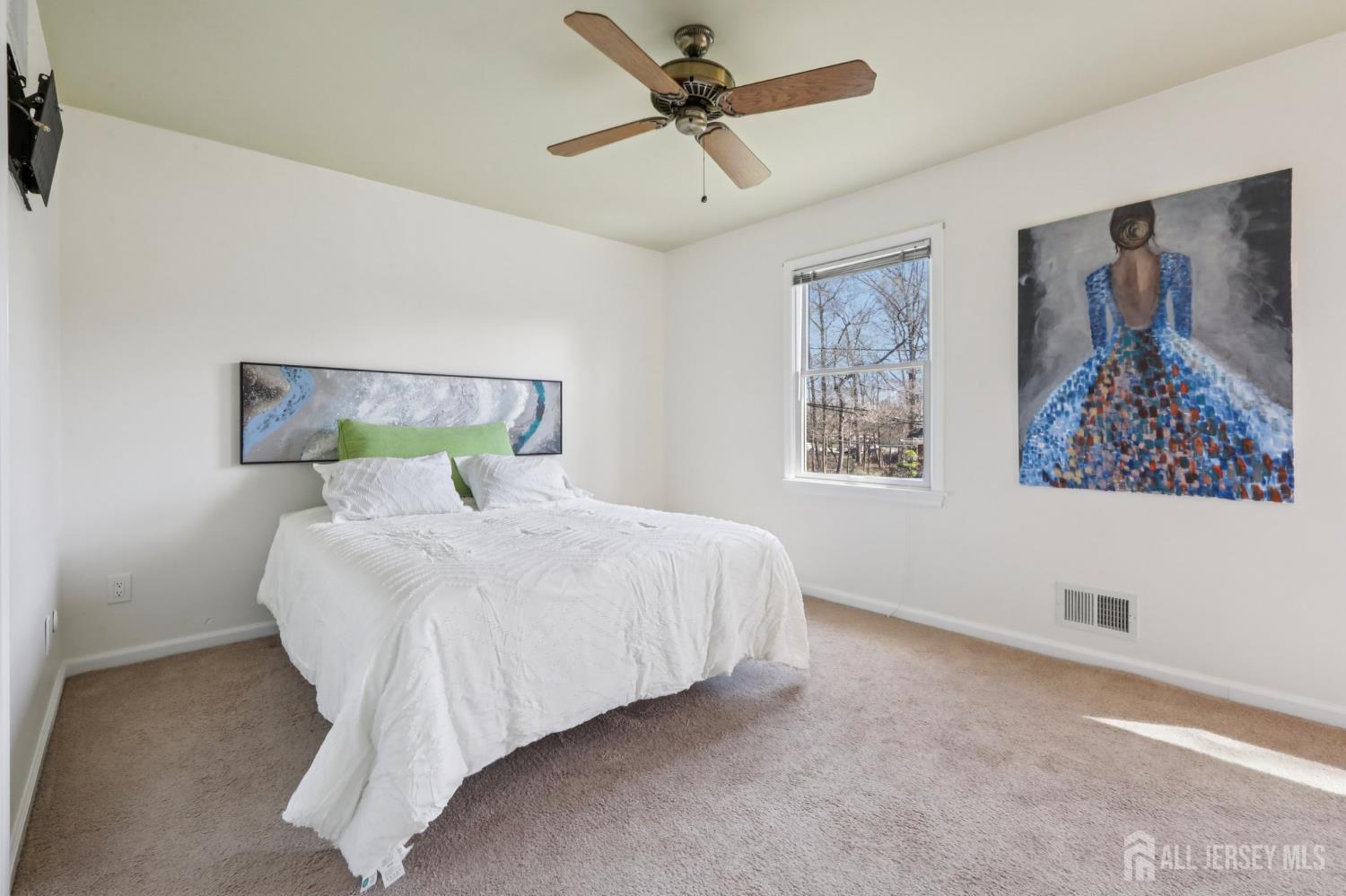 53 Salem Street Edison, NJ 08820 - Photo 20 of 39 a bed sitting in a bedroom next to a window