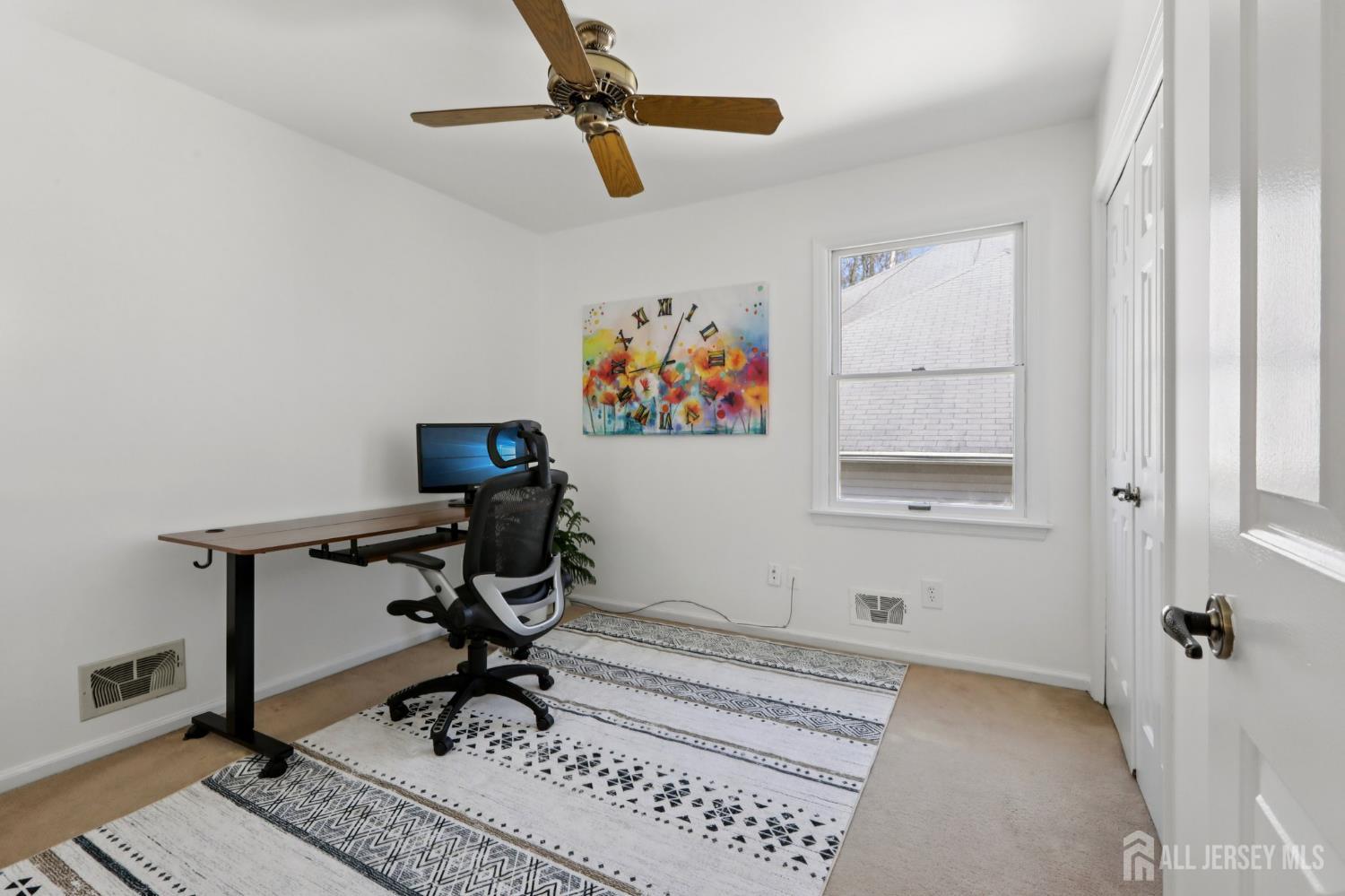 53 Salem Street Edison, NJ 08820 - Photo 24 of 39 a view of workspace with a window and gym equipment