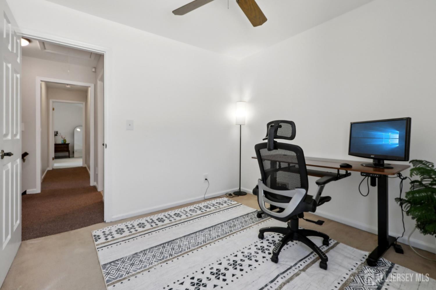 53 Salem Street Edison, NJ 08820 - Photo 25 of 39 a view of a workspace with furniture and a window