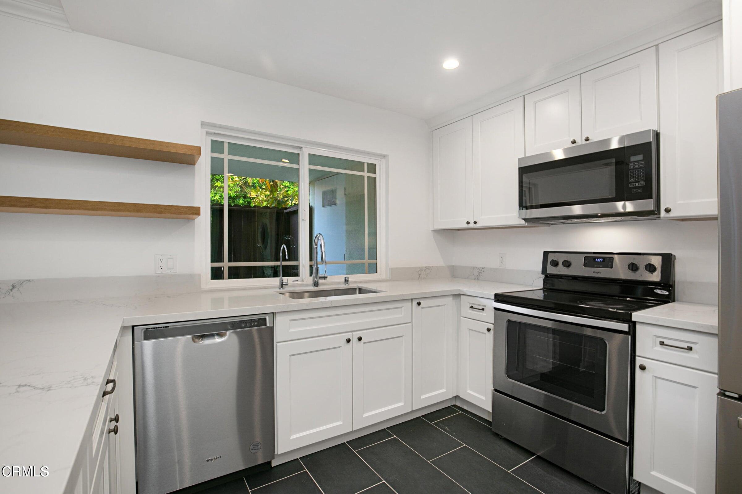 1429 Valley View Road, Unit 13 Glendale, CA 91202 - Photo 12 of 29 a kitchen with a sink stove and microwave