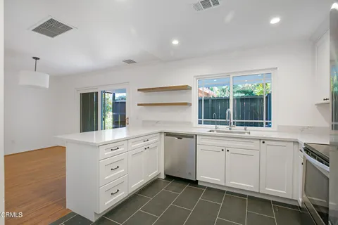 a kitchen with a sink and cabinets