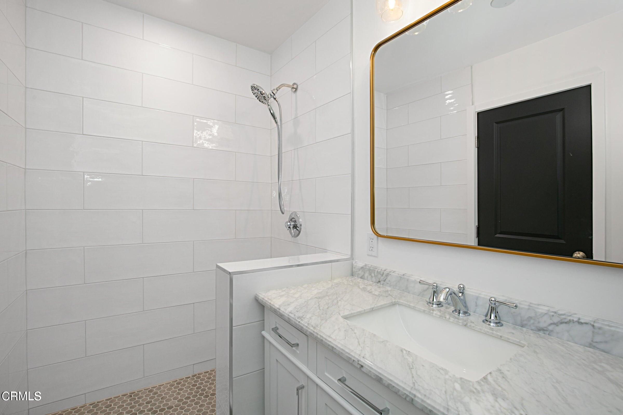 1429 Valley View Road, Unit 13 Glendale, CA 91202 - Photo 20 of 29 a bathroom with a granite countertop sink and a mirror