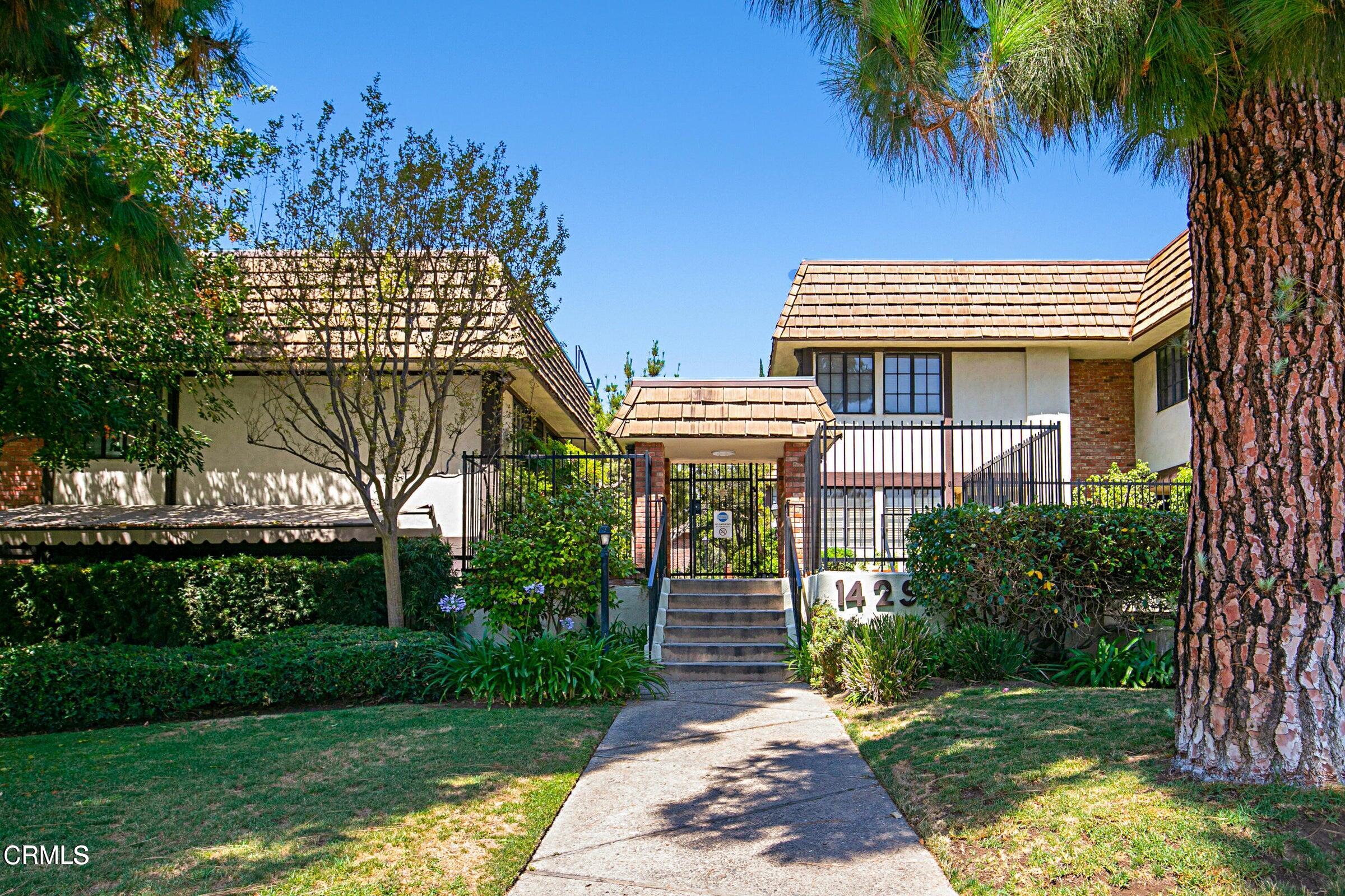 1429 Valley View Road, Unit 13 Glendale, CA 91202 - Photo 2 of 29 a front view of a house with a garden