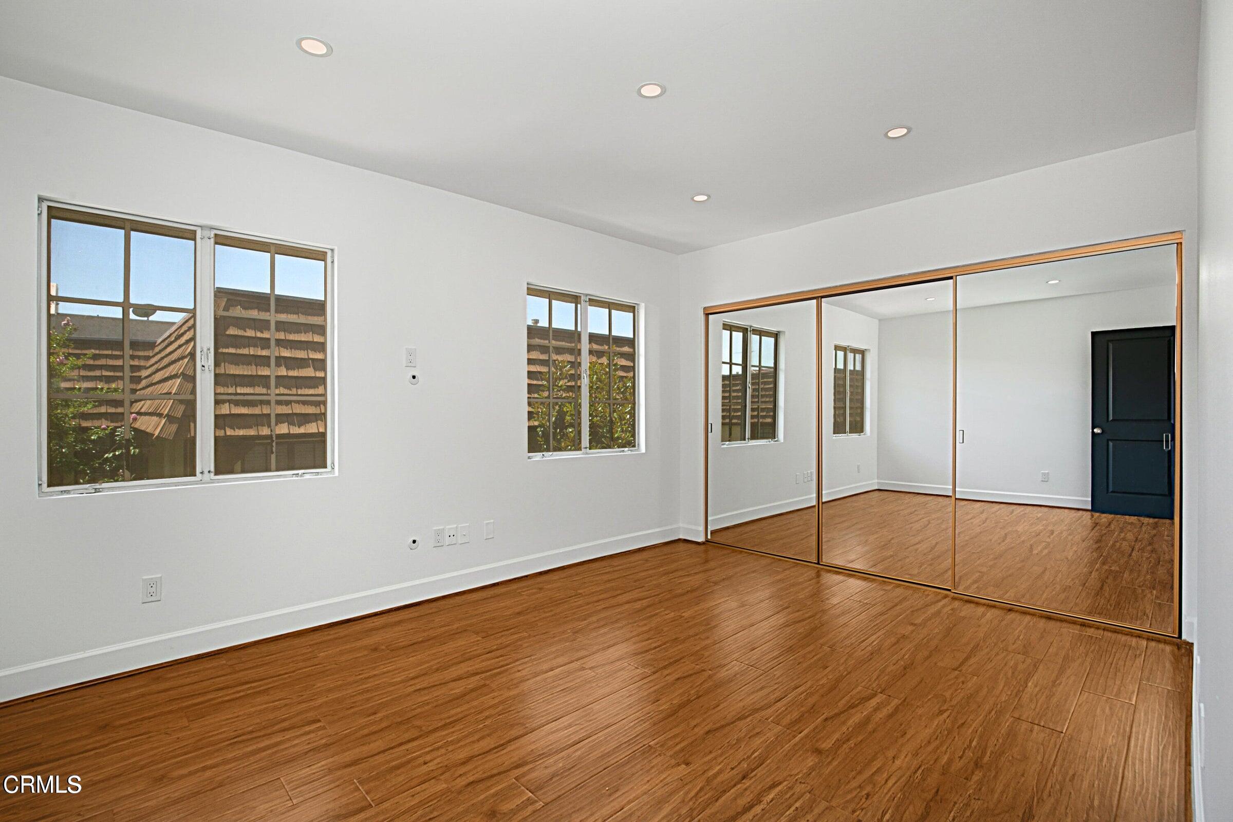 1429 Valley View Road, Unit 13 Glendale, CA 91202 - Photo 21 of 29 a view of an empty room with wooden floor and a window