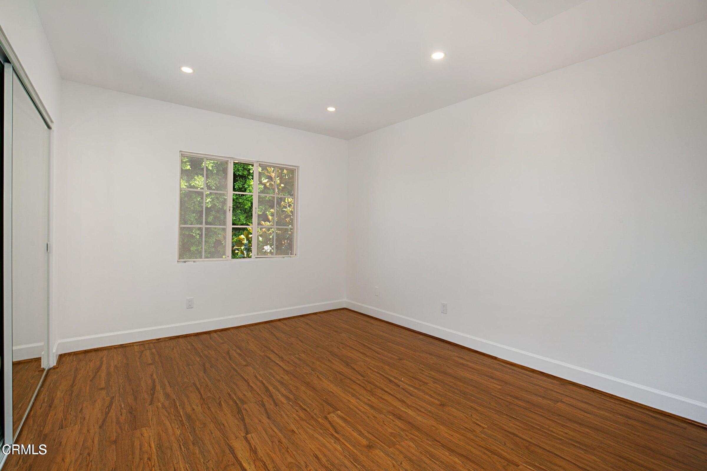 1429 Valley View Road, Unit 13 Glendale, CA 91202 - Photo 23 of 29 wooden floor in an empty room with a window