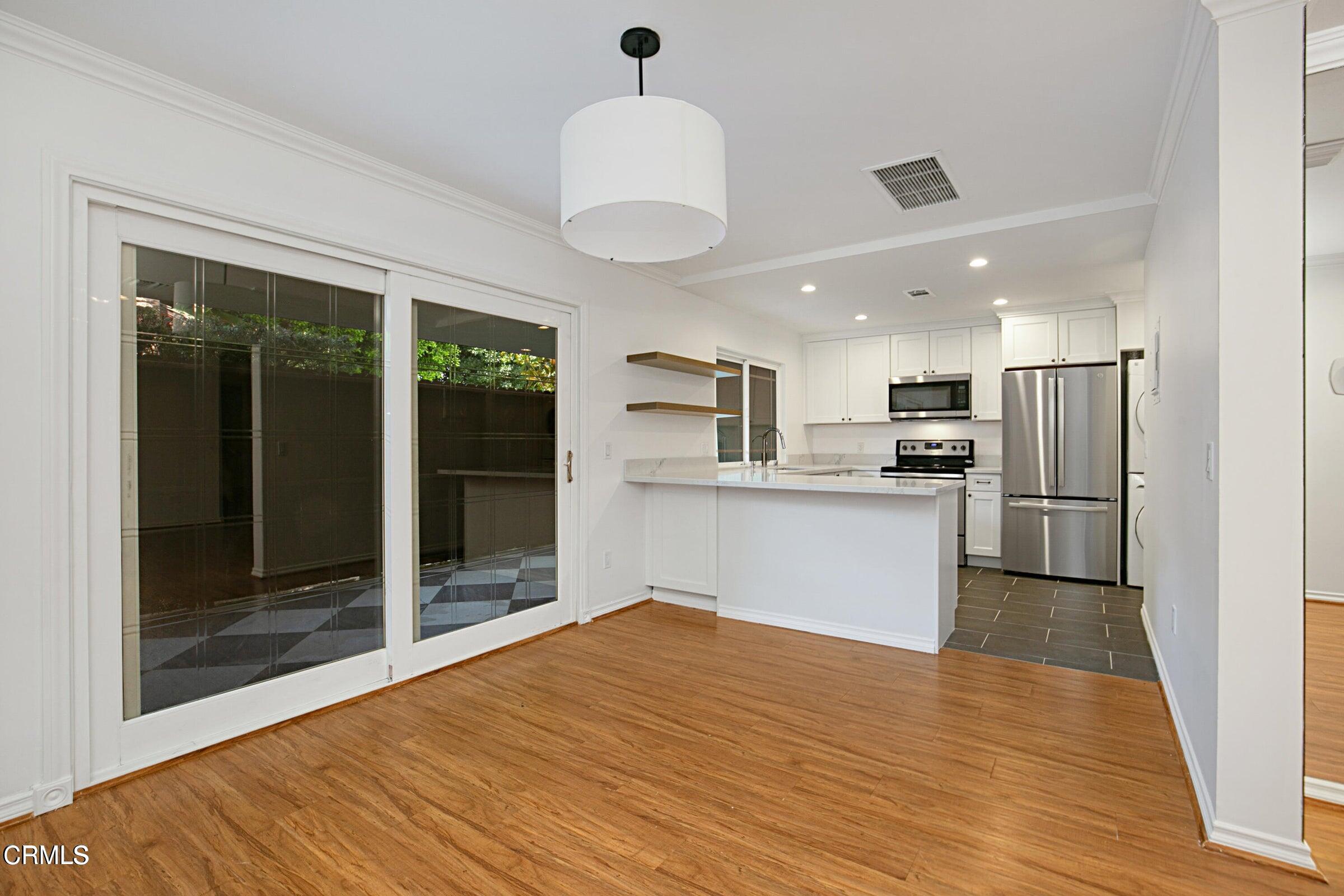 1429 Valley View Road, Unit 13 Glendale, CA 91202 - Photo 10 of 29 a kitchen with stainless steel appliances granite countertop a refrigerator and a sink