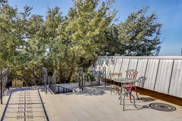 a view of a chairs and tables in the patio