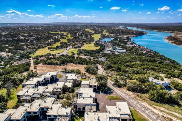 view of a wooden bench next to a yard