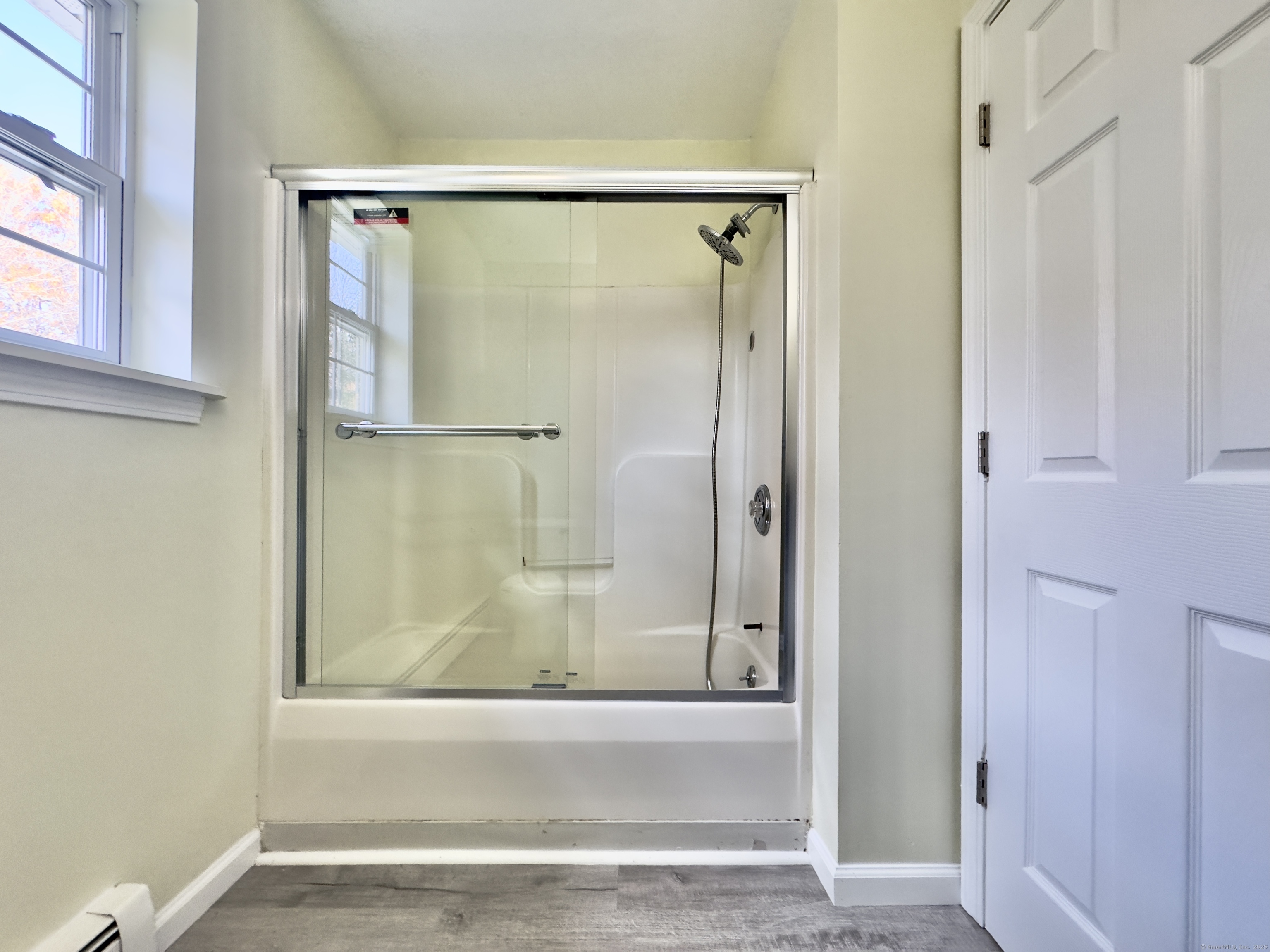 109 Winterberry Way Torrington, CT 06790 - Photo 15 of 22 a bathroom with a glass shower door