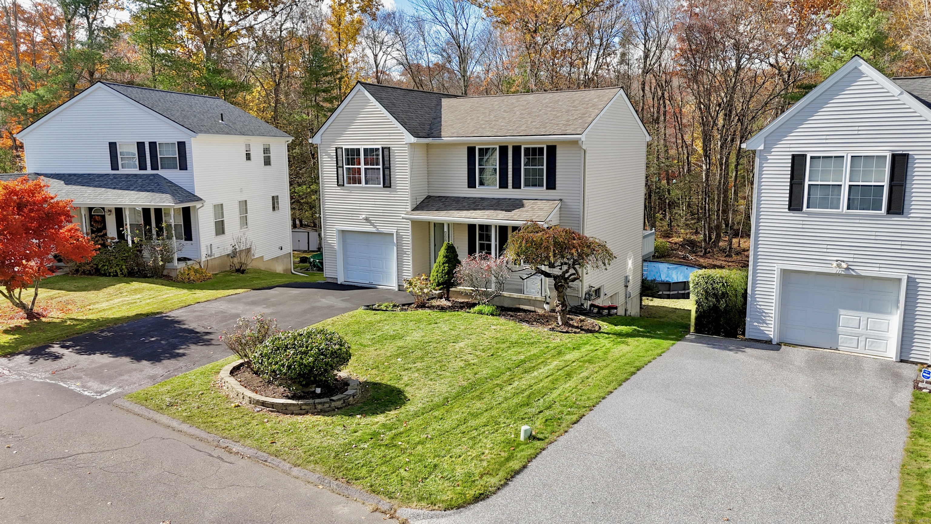 109 Winterberry Way Torrington, CT 06790 - Photo 18 of 22 a front view of a house with garden