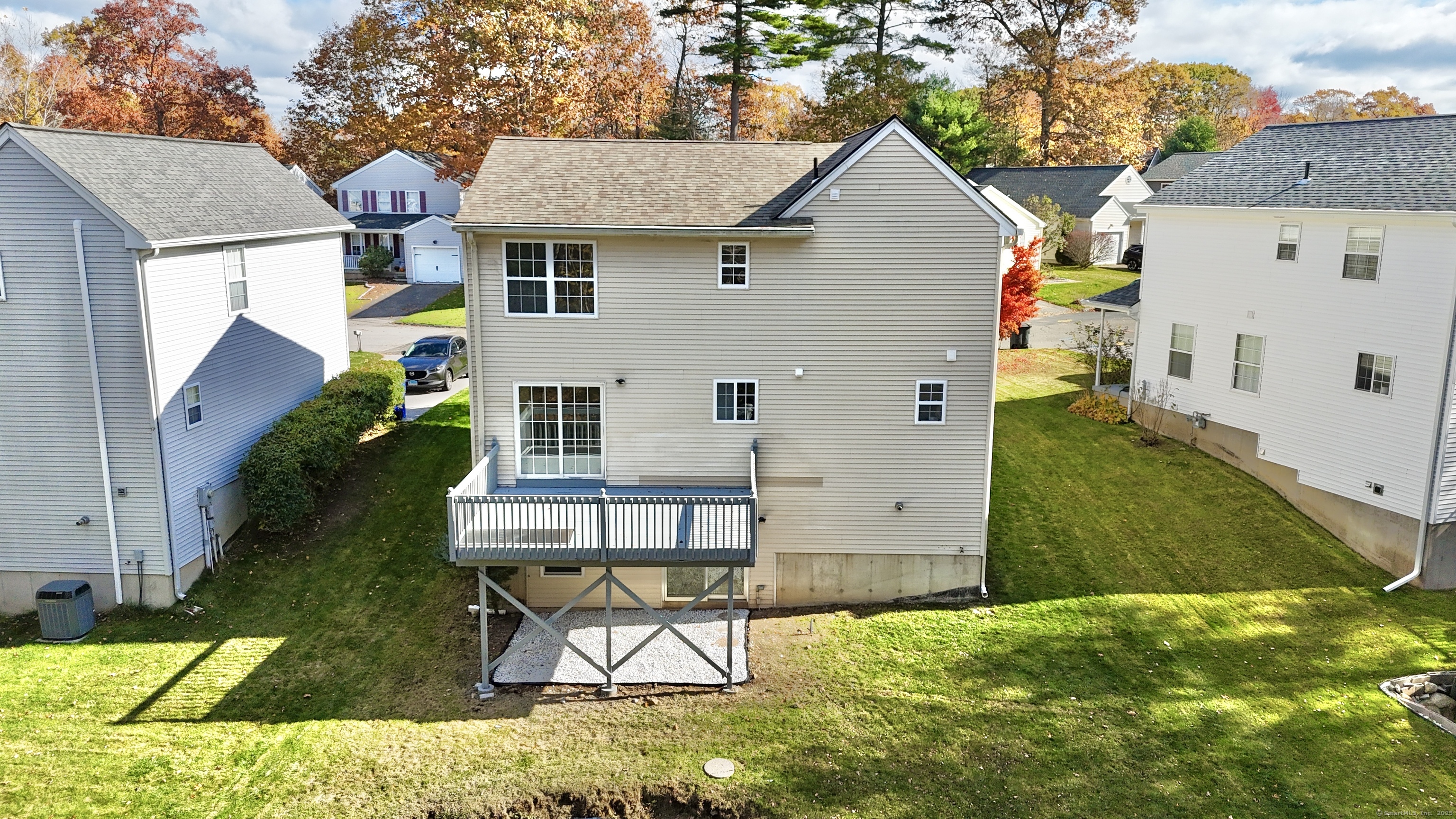 109 Winterberry Way Torrington, CT 06790 - Photo 3 of 22 a view of a backyard with plants and a patio