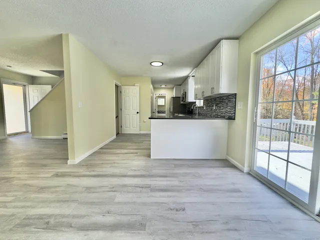 a view of a kitchen from the hallway