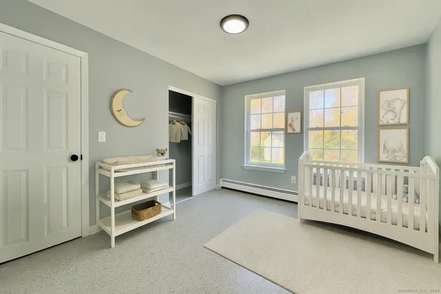 a view of a livingroom with furniture and windows