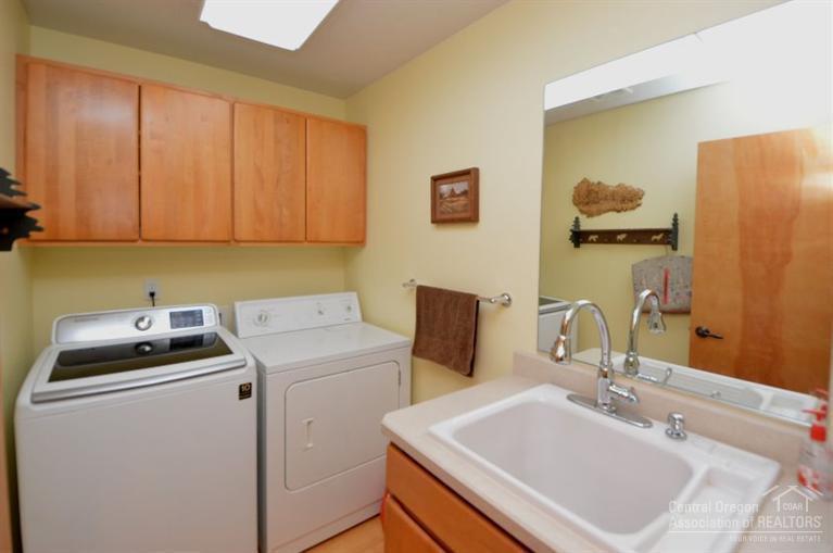 70295 Club Road Sisters, OR 97759 - Photo 17 of 25 Utility room with washer/dryer and utili