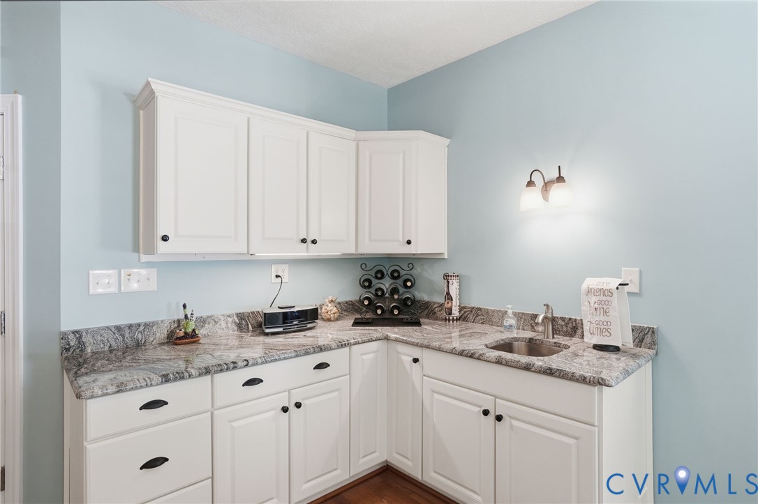 3600 Market Road Mechanicsville, VA 23111 - Photo 22 of 67 a kitchen with granite countertop white cabinets and sink