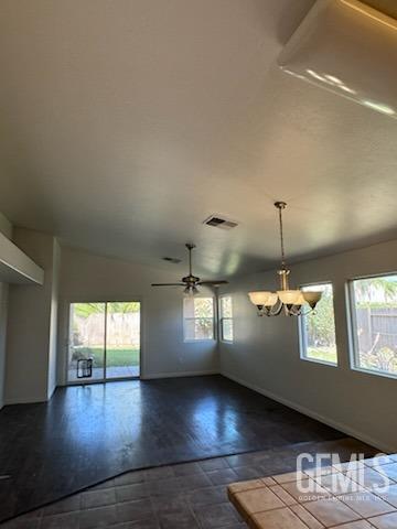 Undisclosed Address Bakersfield, CA 93313 - Photo 2 of 7 a view of an empty room with wooden floor and a window