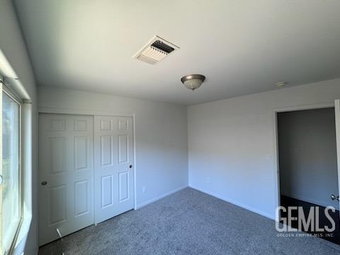 Undisclosed Address Bakersfield, CA 93313 - Photo 4 of 7 an empty room with a bench