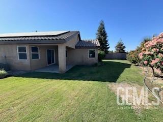 Undisclosed Address Bakersfield, CA 93313 - Photo 5 of 7 a view of a house with a yard