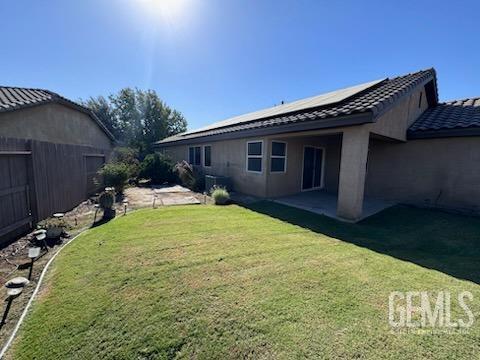 Undisclosed Address Bakersfield, CA 93313 - Photo 6 of 7 a backyard of a house with yard table and chairs