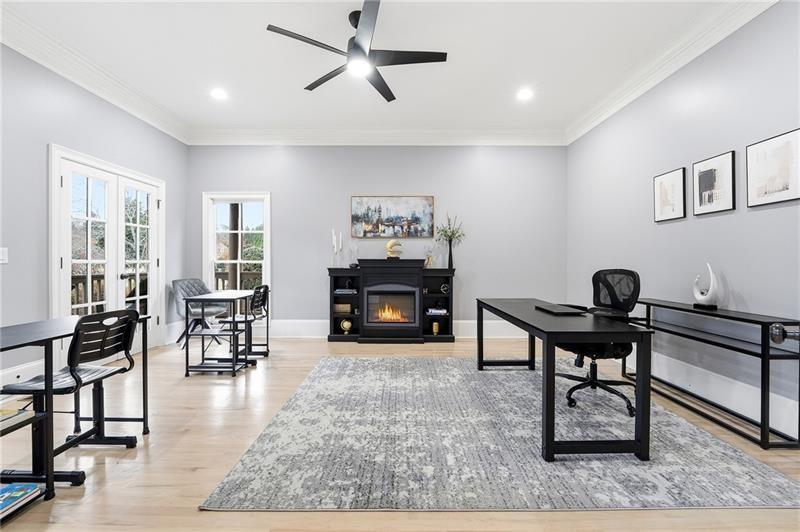 170 Golf Link View Milton, GA 30004 - Photo 14 of 54 a living room with furniture a rug and a fireplace