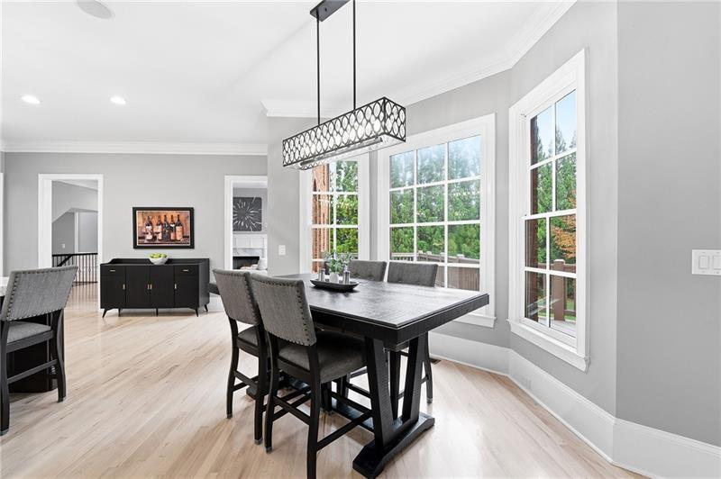 170 Golf Link View Milton, GA 30004 - Photo 19 of 54 a view of a dining room with furniture window and wooden floor