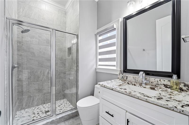 170 Golf Link View Milton, GA 30004 - Photo 27 of 54 a bathroom with a granite countertop sink toilet and shower