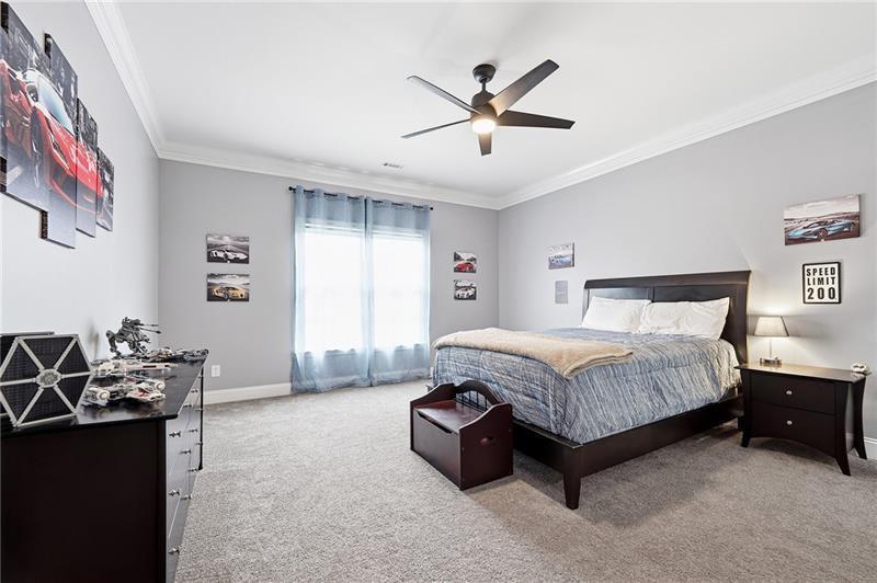 170 Golf Link View Milton, GA 30004 - Photo 34 of 54 a spacious bedroom with a bed and a chandelier