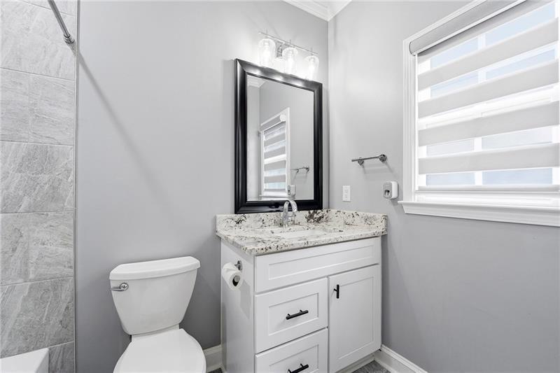 170 Golf Link View Milton, GA 30004 - Photo 37 of 54 a bathroom with a toilet sink and mirror