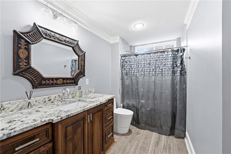 170 Golf Link View Milton, GA 30004 - Photo 45 of 54 a bathroom with a granite countertop sink toilet and shower
