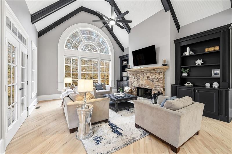 170 Golf Link View Milton, GA 30004 - Photo 5 of 54 a living room with furniture a fireplace and a flat screen tv