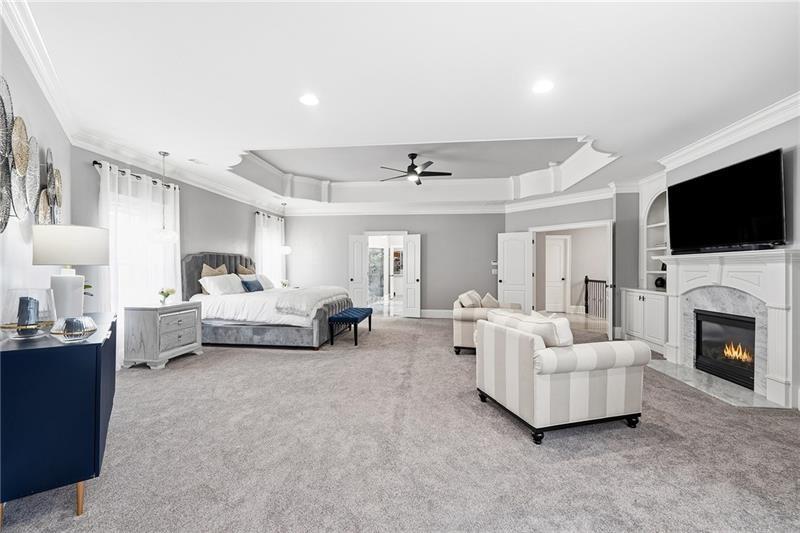 170 Golf Link View Milton, GA 30004 - Photo 6 of 54 a living room with furniture a flat screen tv and a fireplace