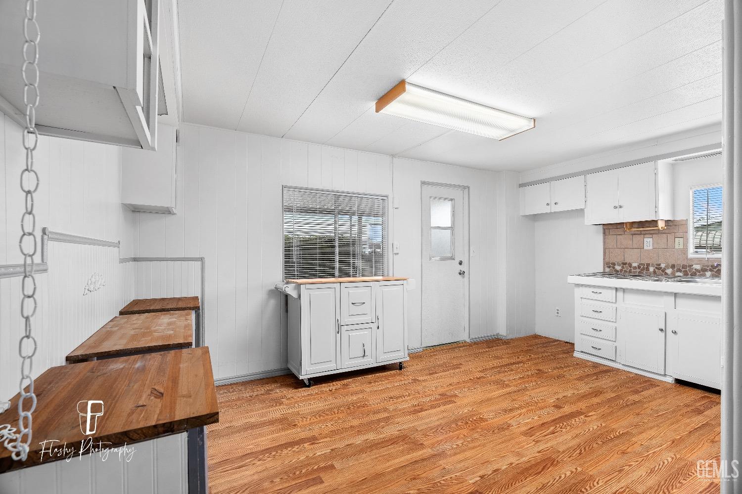 Undisclosed Address Bakersfield, CA 93301 - Photo 12 of 27 a bedroom with a bed and a dresser