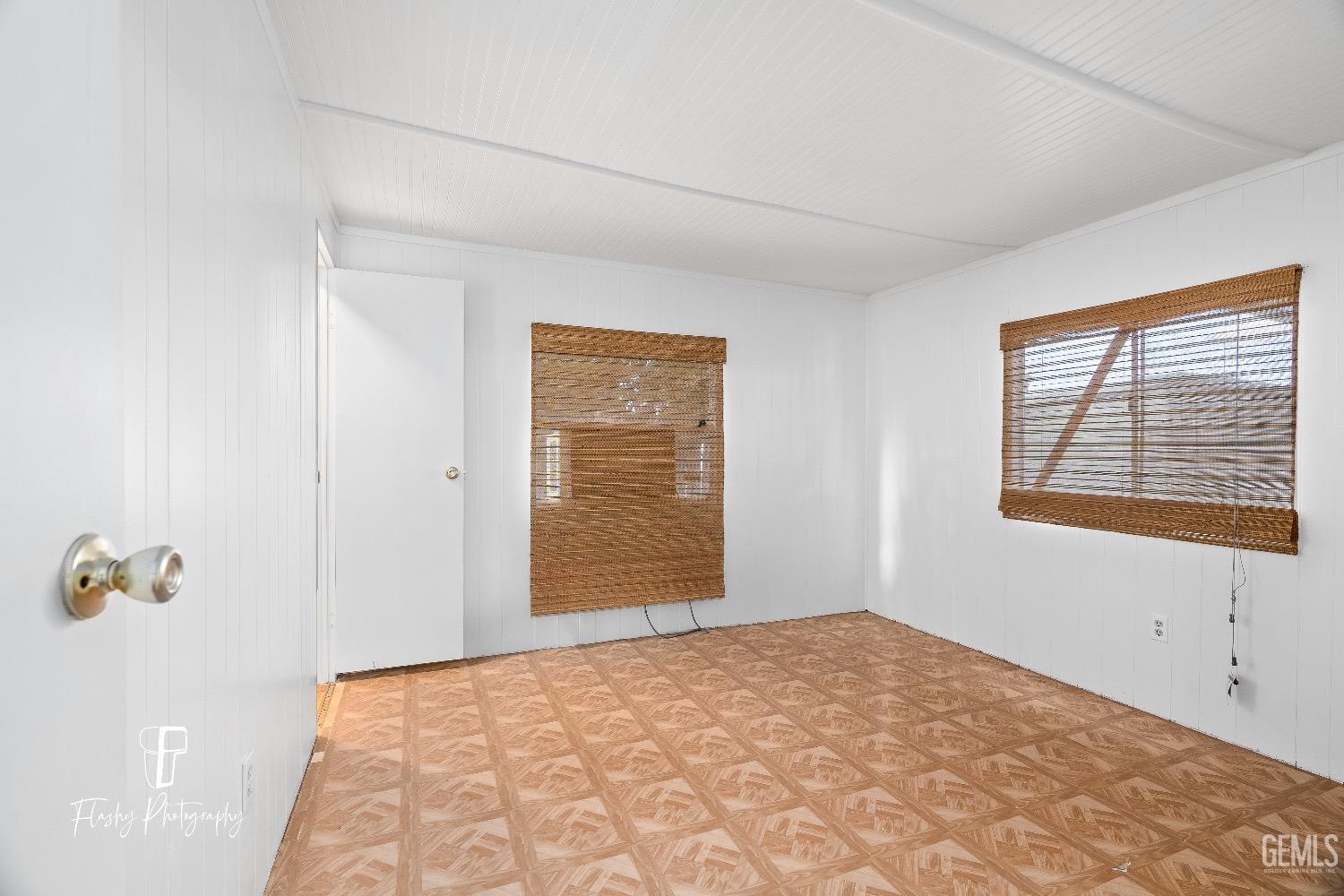 Undisclosed Address Bakersfield, CA 93301 - Photo 13 of 27 a view of an empty room with a window