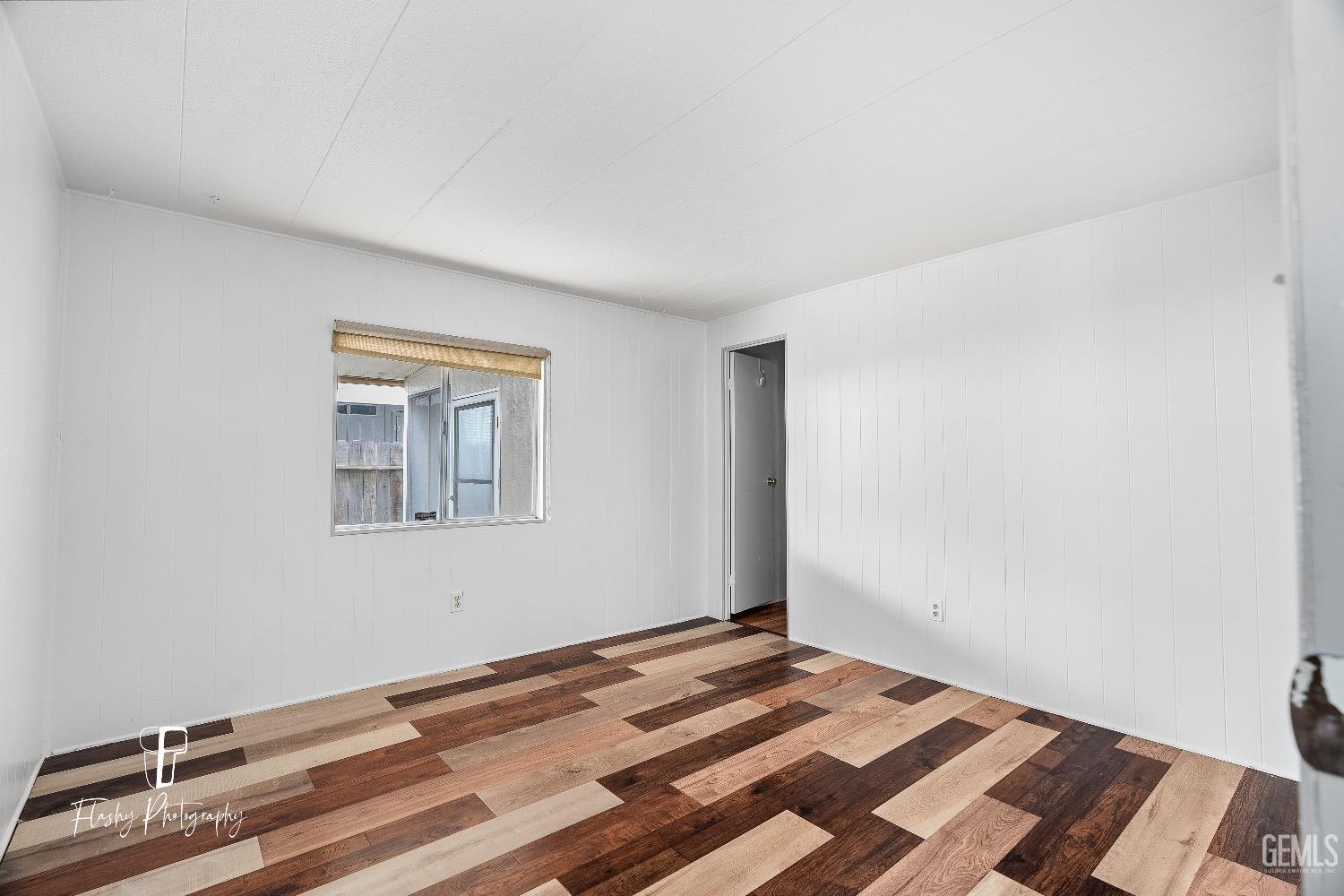 Undisclosed Address Bakersfield, CA 93301 - Photo 18 of 27 a view of a livingroom with wooden floor and a bathroom