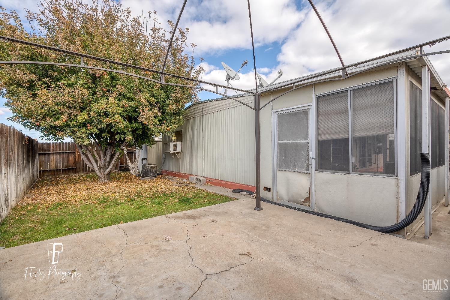Undisclosed Address Bakersfield, CA 93301 - Photo 25 of 27 a view of a house with a park