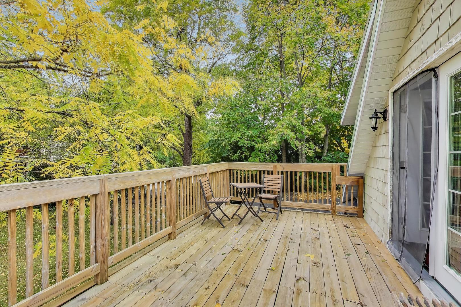 207 Shady Lane Mundelein, IL 60060 - Photo 18 of 28 a view of balcony with wooden floor and fence