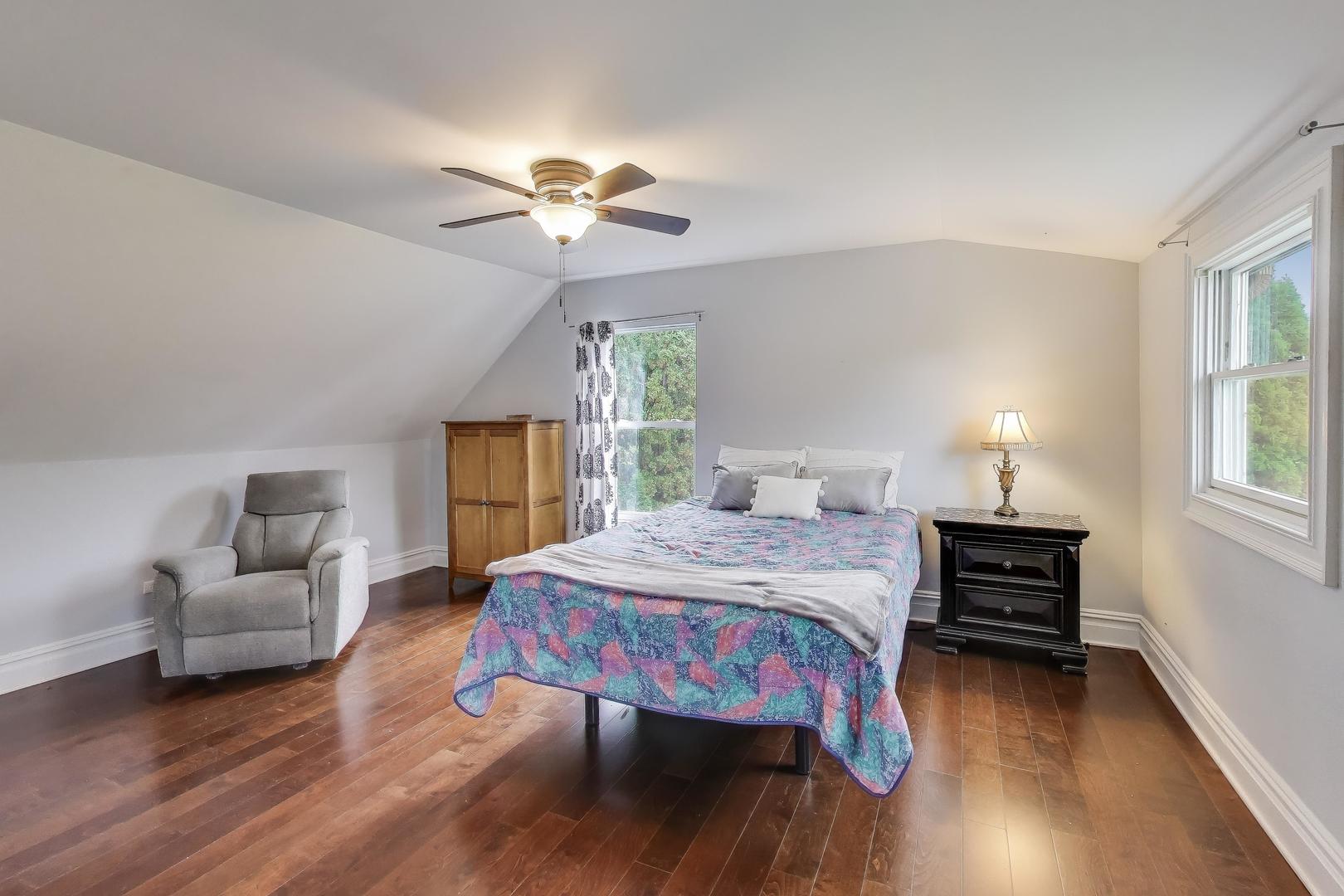 207 Shady Lane Mundelein, IL 60060 - Photo 19 of 28 a bedroom with a bed and wooden floor