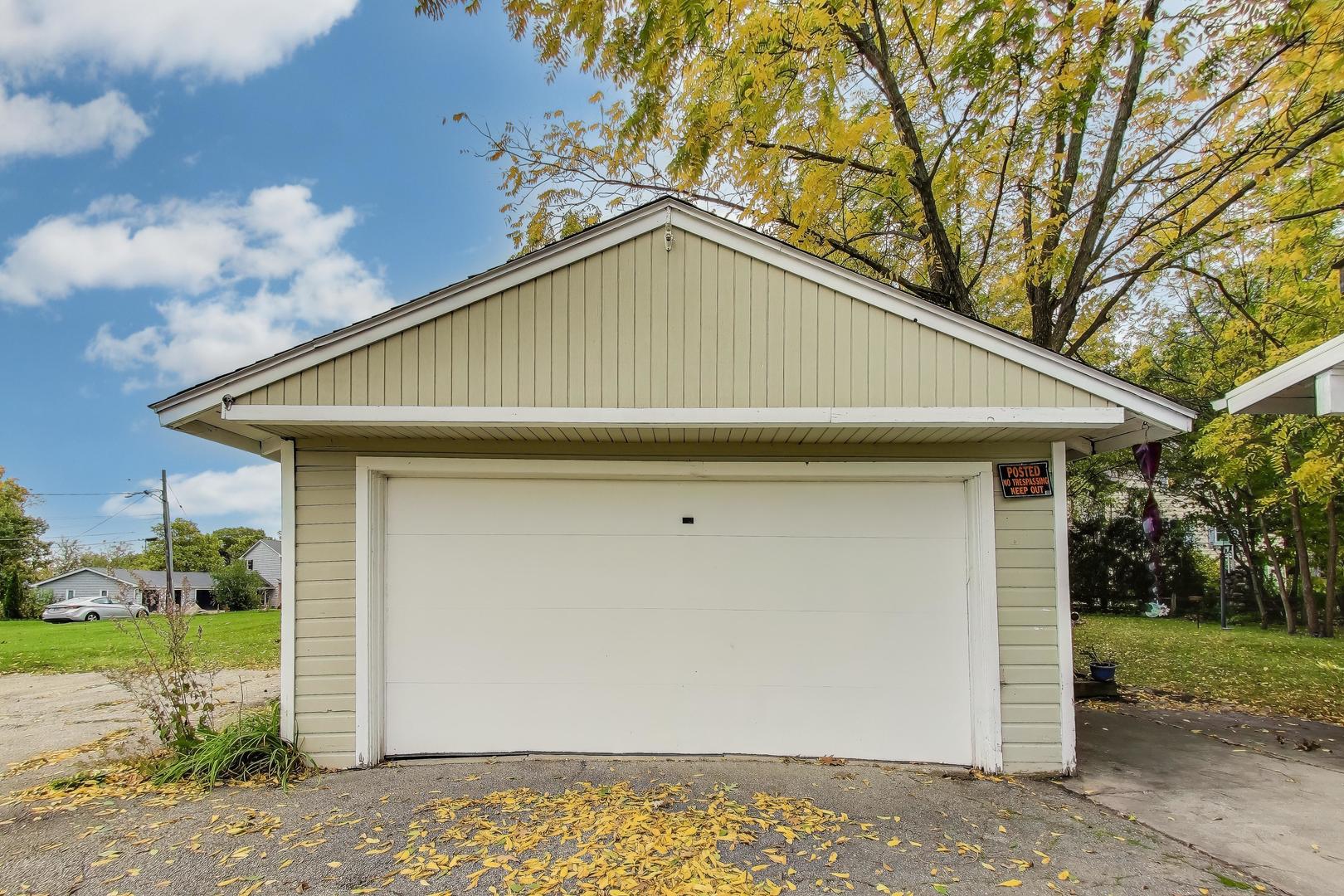 207 Shady Lane Mundelein, IL 60060 - Photo 24 of 28 a small white house with a outdoor space