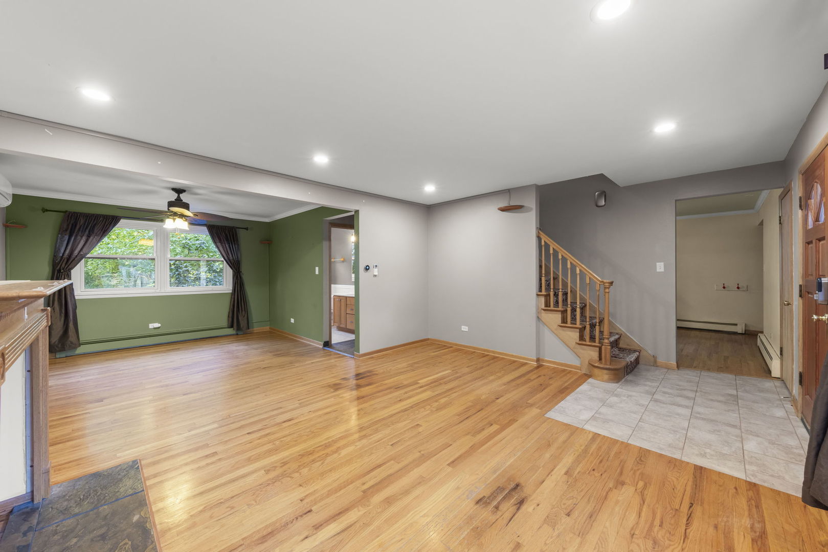 18000 Armitage Court Homewood, IL 60430 - Photo 4 of 23 a view of an empty room with wooden floor and a window