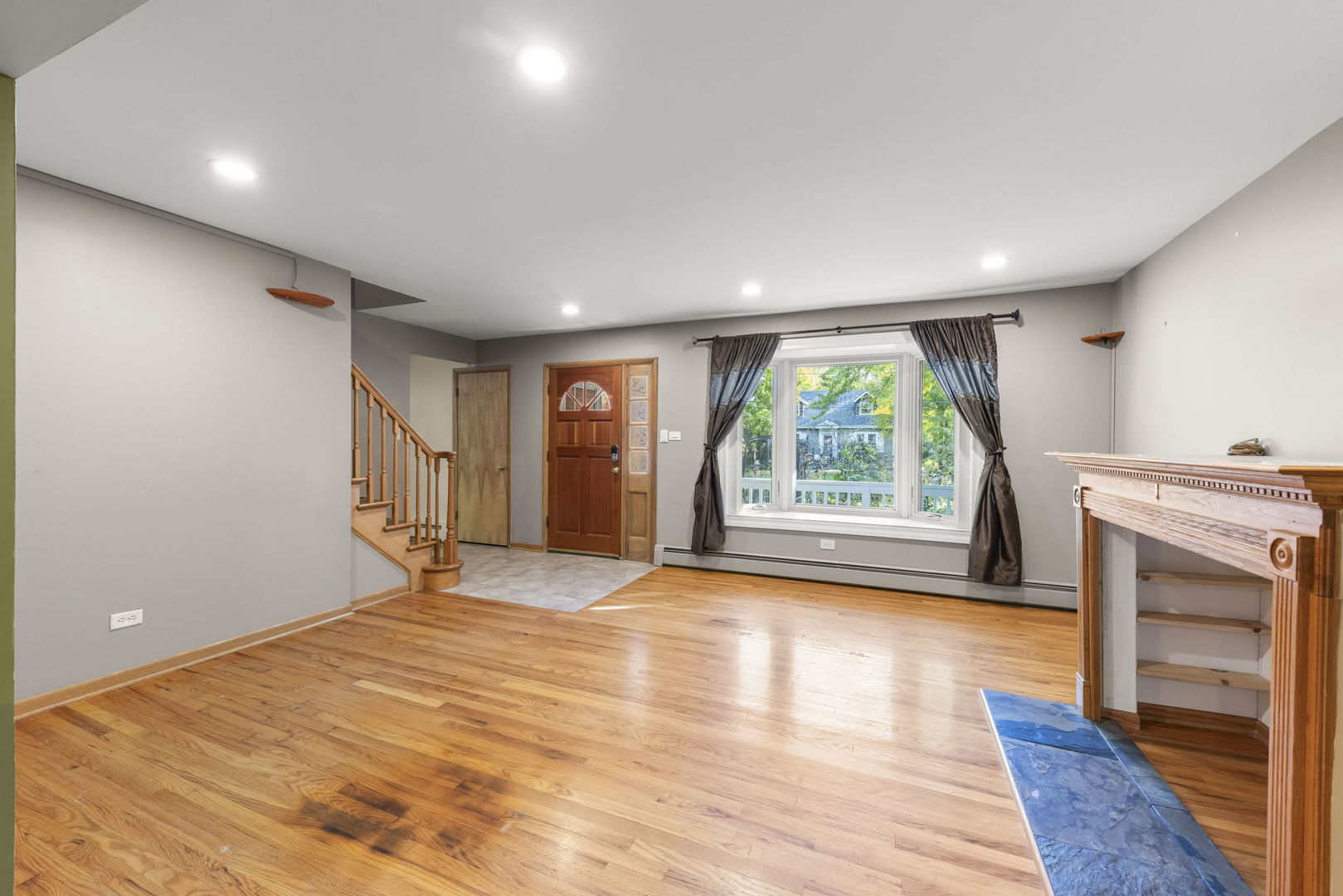 18000 Armitage Court Homewood, IL 60430 - Photo 5 of 23 a view of an empty room with a window and wooden floor