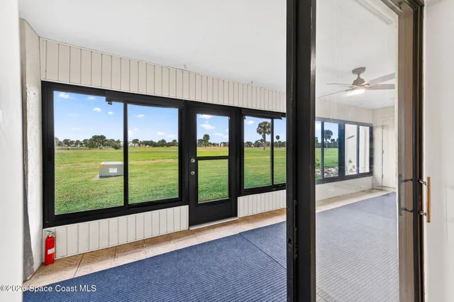 a view of hallway with livingroom