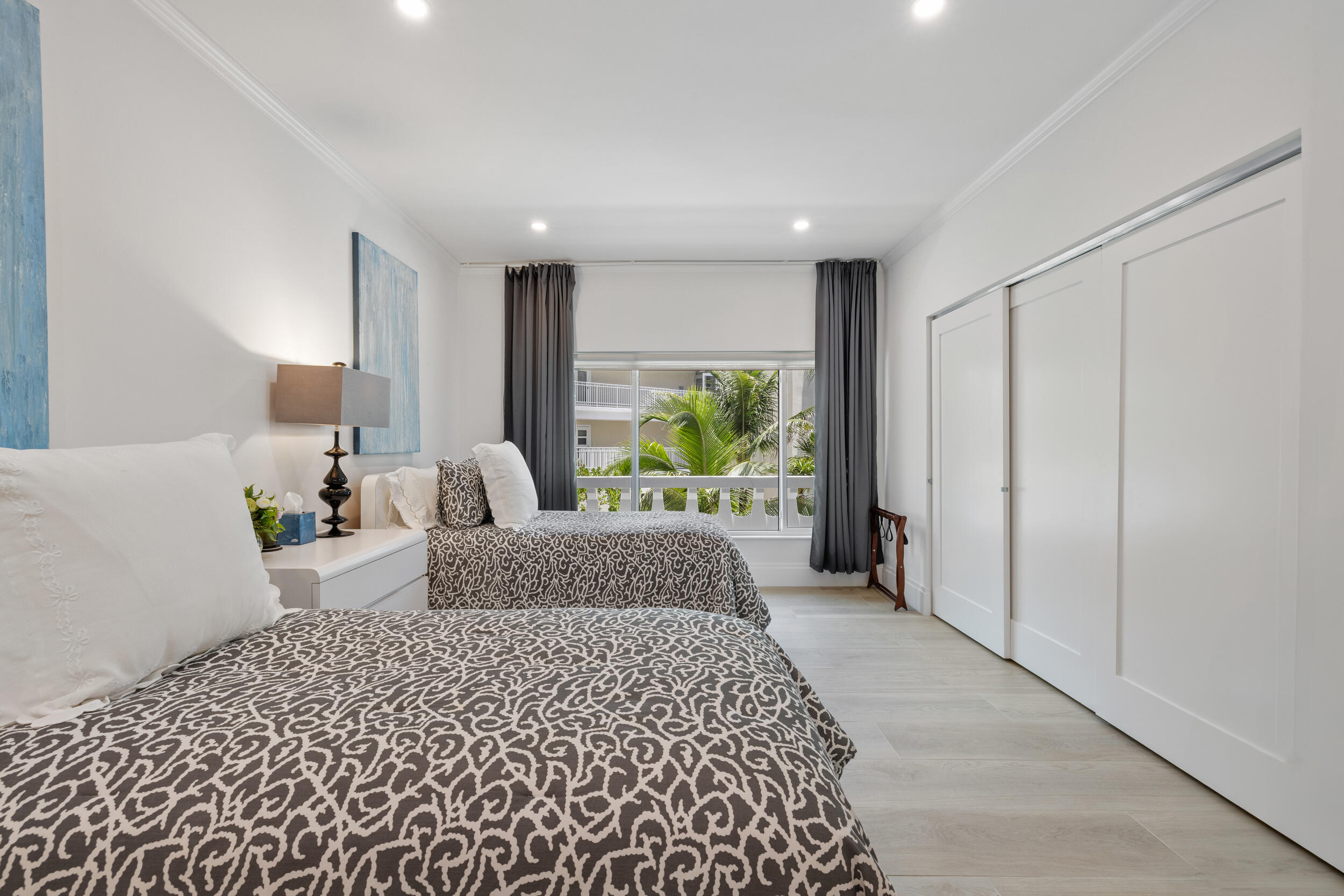 300 South Ocean Boulevard, Unit 3G Palm Beach, FL 33480 - Photo 11 of 25 a bedroom with a large bed and a large window