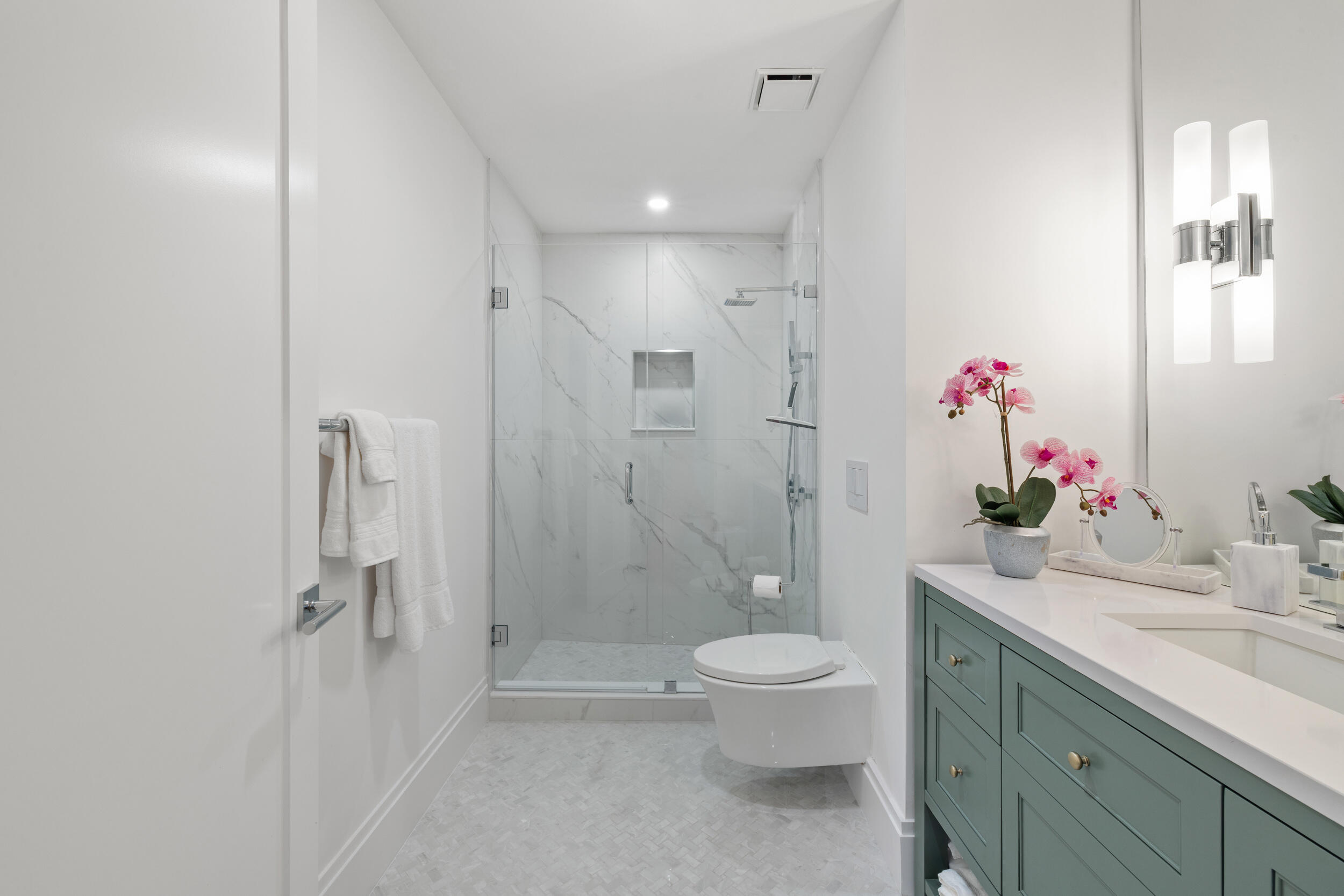 300 South Ocean Boulevard, Unit 3G Palm Beach, FL 33480 - Photo 13 of 25 a bathroom with a sink vanity mirror and toilet