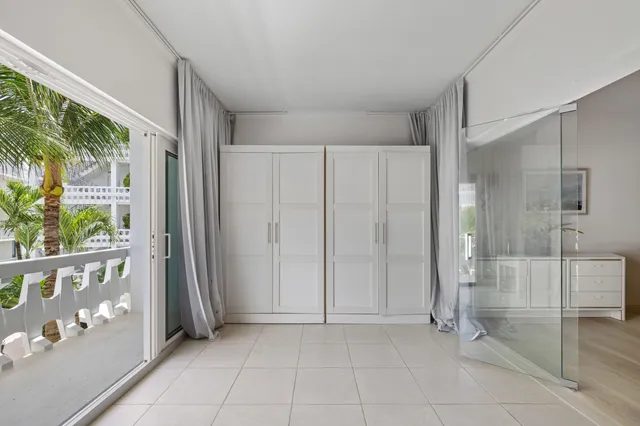 a view of an entryway with wooden floor and door